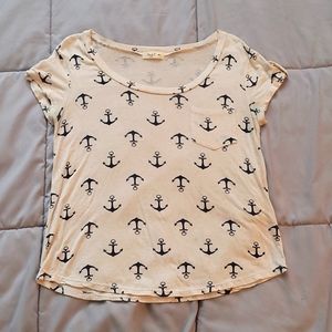 Tan t-shirt with dark blue anchors. Size medium.